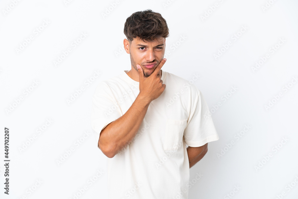 Young caucasian handsome man isolated on white background having doubts Young caucasian handsome man isolated on white background having doubts