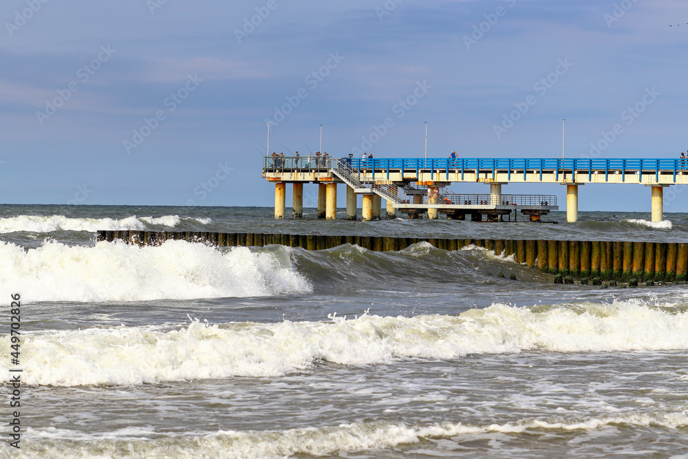Pier in the city of Zelenogradsk during a storm. Waves in the Baltic Sea