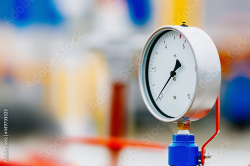 This is a close-up pressure gauge for measuring the pressure on a pipe for gasification or gas transportation. Background for the article with space for copying on the topic of construction and launch photo