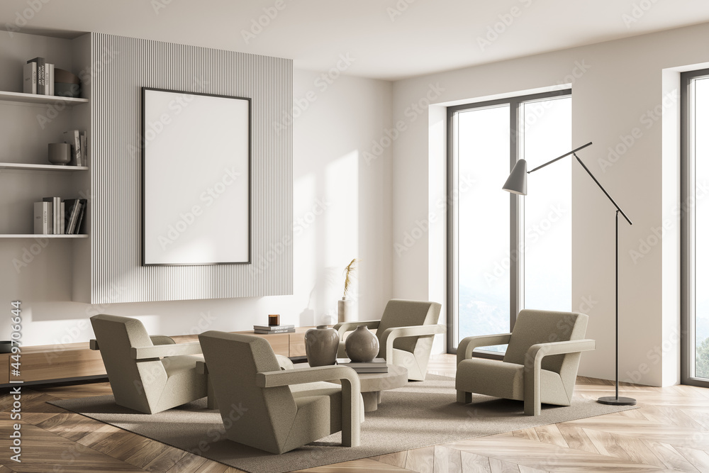 Living room with armchairs and wall panelling in mild shades. Corner view Living room with armchairs and wall panelling in mild shades. Corner view