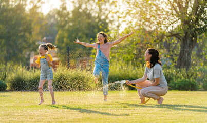 Happy family playing in backyard