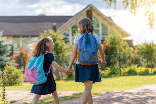 Girls with backpack are going to school