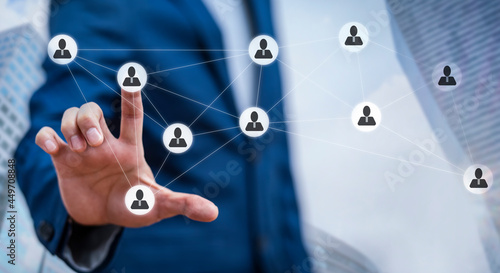 Businessman holding HR Human ,people icon on the graph Screen of a media screen, Technology Process System Business with Recruitment, Hiring, Team Building. Organisation structure concept.