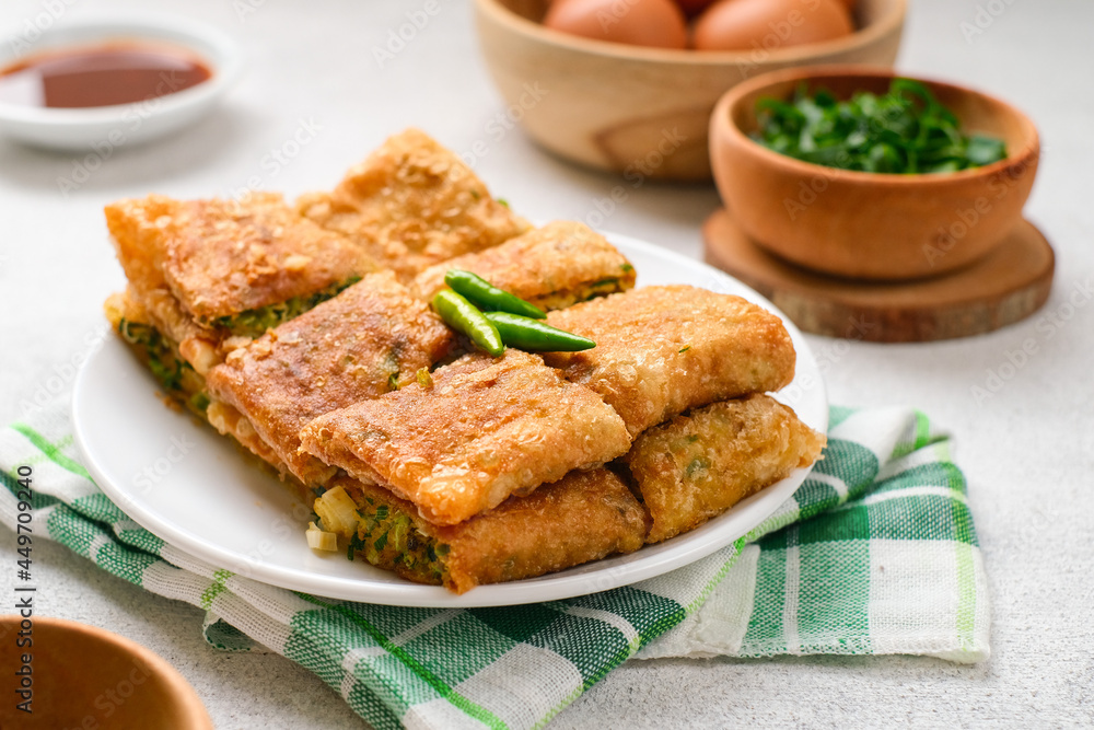 Martabak Telor or Martabak Telur. Savory pan-fried pastry stuffed with egg, meat and spices. Martabak Telor or Martabak Telur. Savory pan-fried pastry stuffed with egg, meat and spices.