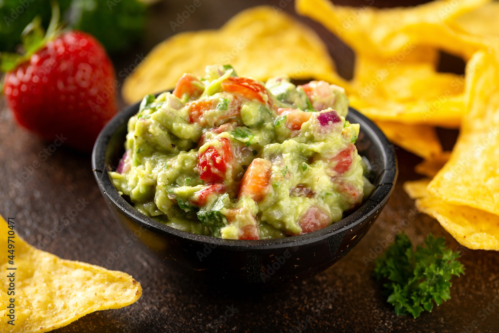 Strawberry and avocado guacamole, salsa with crispy tortilla chips