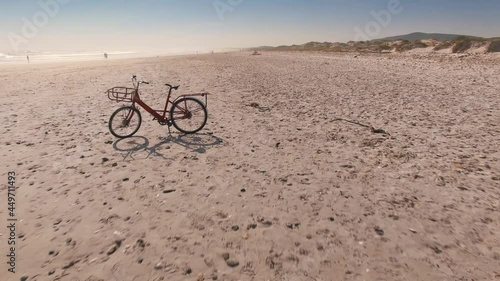 Aerial: Red bike on a beach. Cape Town, South Africa