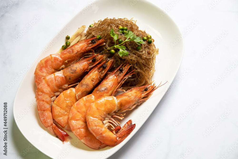 Shrimp potted with vermicelli; dipping black vinegar sauce or spicy seafood sauce. Main Ingredient is glass noodle, coriander roots, pepper, garlic, ginger and shrimp. Shrimp potted with vermicelli; dipping black vinegar sauce or spicy seafood sauce. Main Ingredient is glass noodle, coriander roots, pepper, garlic, ginger and shrimp.