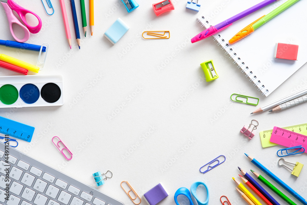 Flat lay colorful school supplies on white background. Back to school concept. Top view, overhead. Flat lay colorful school supplies on white background. Back to school concept. Top view, overhead.