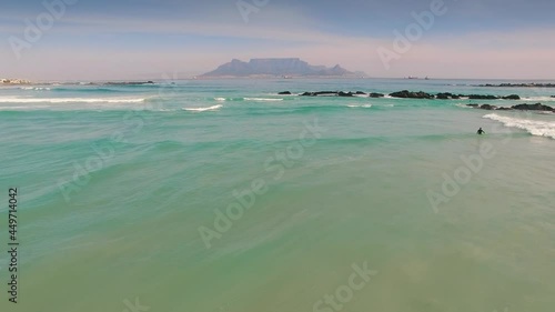 Aerial: Waves Crashing on tropical beach. Cape Town, South Africa