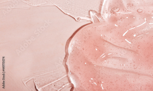 Transparent pink cosmetic smear of gel, serum