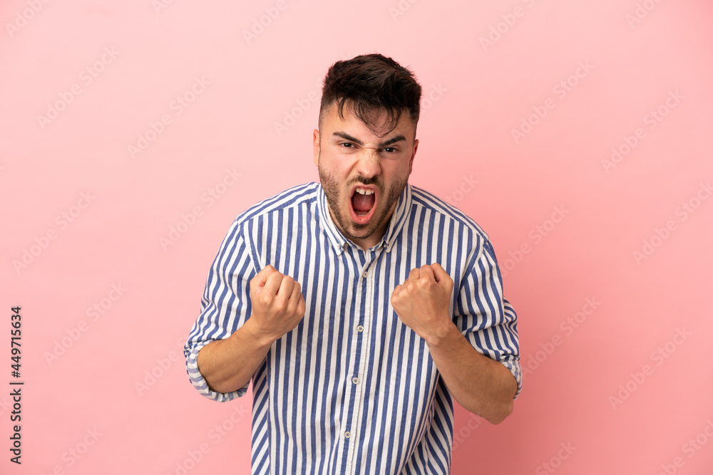 Fototapeta premium Young caucasian man isolated on pink background frustrated by a bad situation