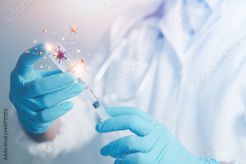 A doctor or scientist in a vaccine research and development lab analyzes antibody samples for medical patients to protect against COVID-19. The mutant carried a syringe containing the liquid vaccine.