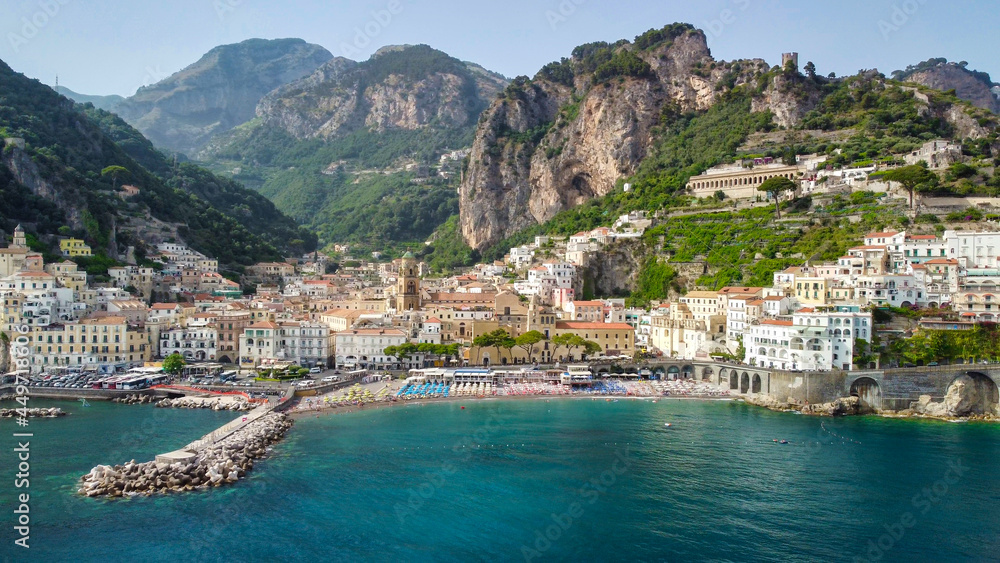 AMALFI, ITALY - JUN 28, 2021: Panoramic aerial view of Amalfi coastline from a moving drone.
