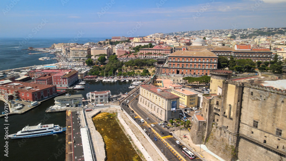 Naples, Italy. Aerial view of city port from a drone going up in the sky.