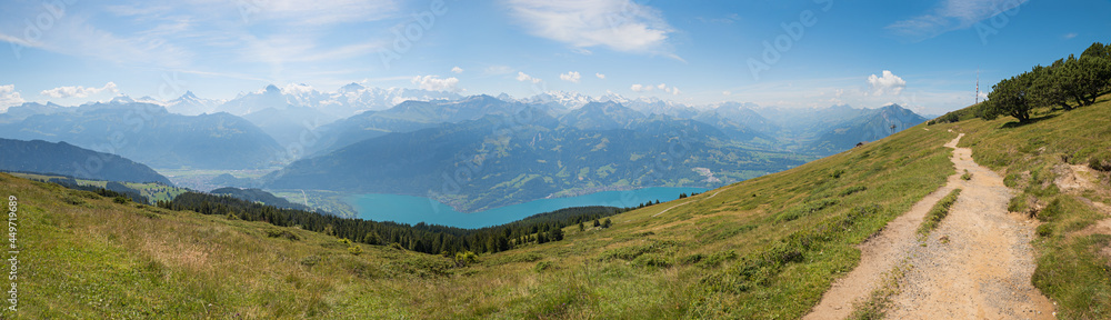 hiking trail at Niederhorn mountain ridge, with stunning view to bernese alps, switzerland