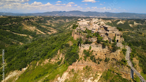 Panoramic aerial view of Civita di Bagnoregio from a flying drone around the medieval city  Italy.