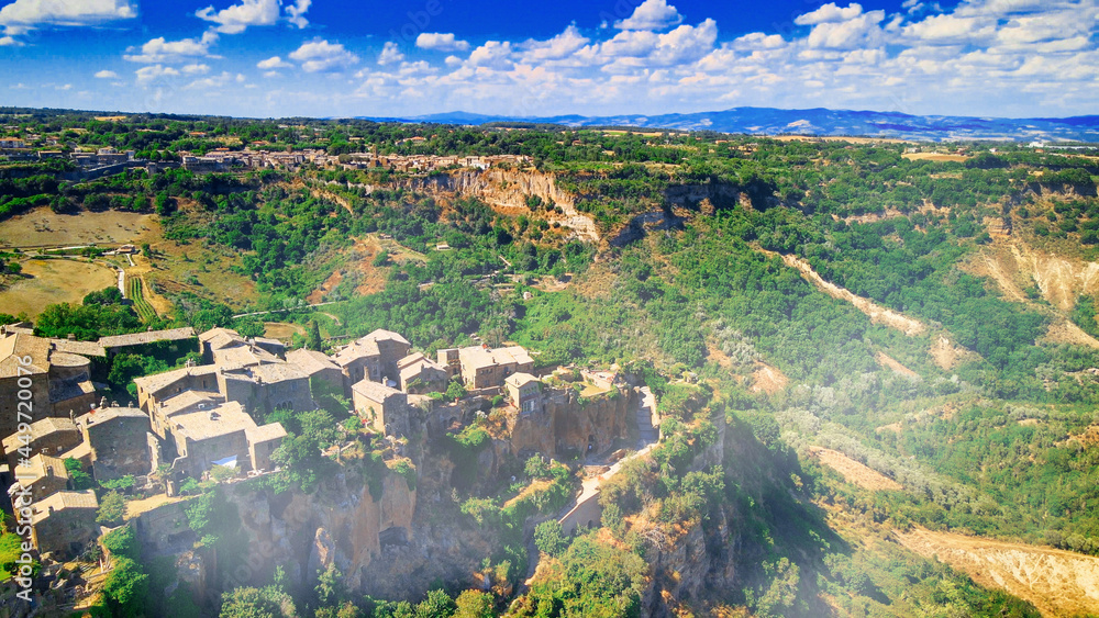 Approaching medieval town of Civita di Bagnoregio from a drone, Italy.