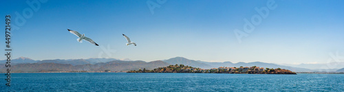 Megri Island or Fethiye Island of the Gulf of Telmessos on exit to Fethiye Harbour, Turkey. Turkish Riviera, yachting and luxury sea vacation on the Aegean coast.