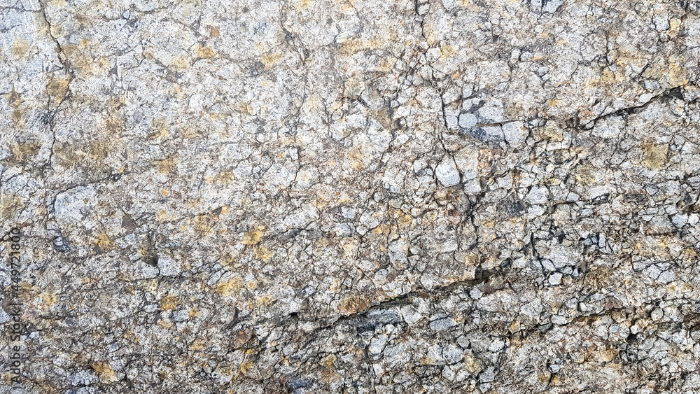 stone texture or background. Coarse cracked stone structure of the face. empty gray stone texture or background stone texture or background. Coarse cracked stone structure of the face. empty gray stone texture or background