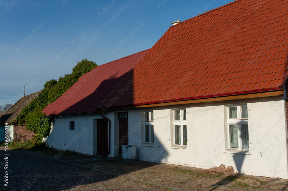 Old house with new tiled roof. Studzienna Street. Czaplinek, Poland. Old house with new tiled roof. Studzienna Street. Czaplinek, Poland.