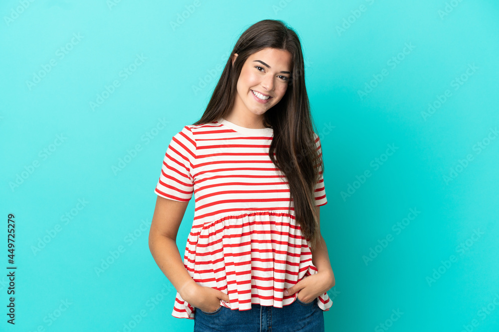 Young Brazilian woman isolated on blue background laughing