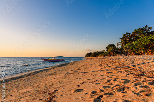 Sunset or sunrise at beach with quiet ocean in Gili Meno island