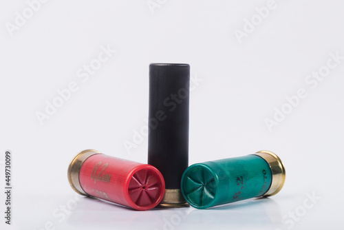 Hunting rifle cartridges. Cartridges on a white isolated background. Cartridges on a wooden table. 