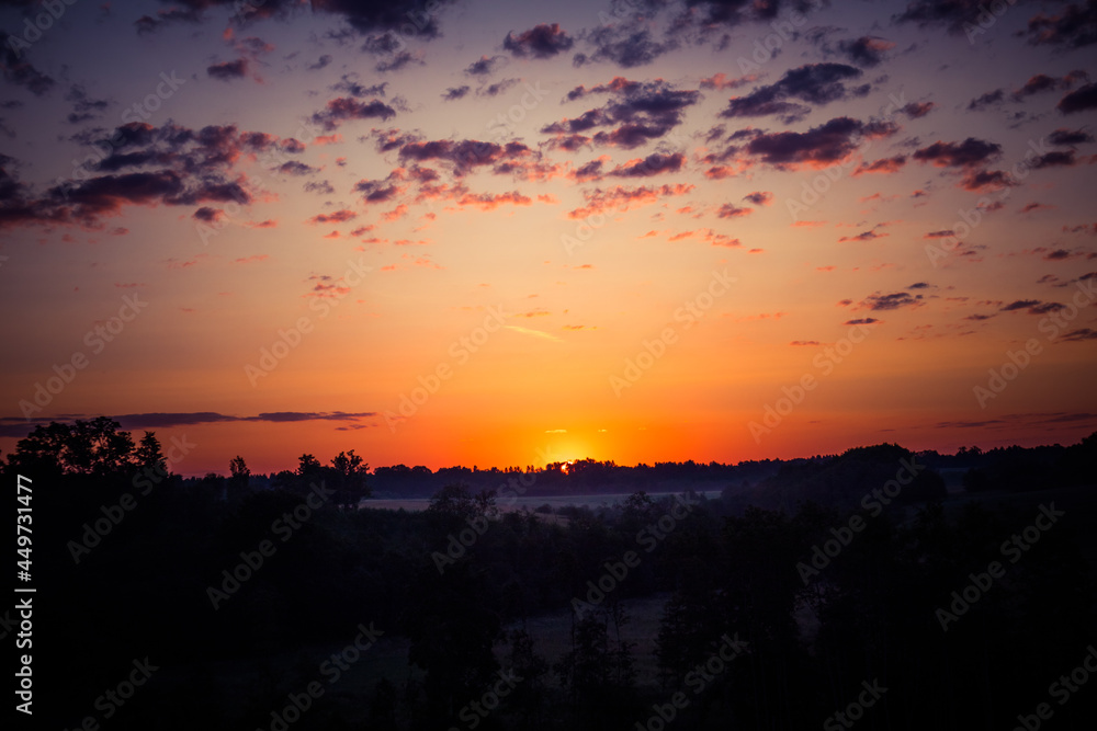 A beautiful evening scenery of a rural landscape. Sunset in the country landscape. Summertime scenery of Northern Europe. A beautiful evening scenery of a rural landscape. Sunset in the country landscape. Summertime scenery of Northern Europe.