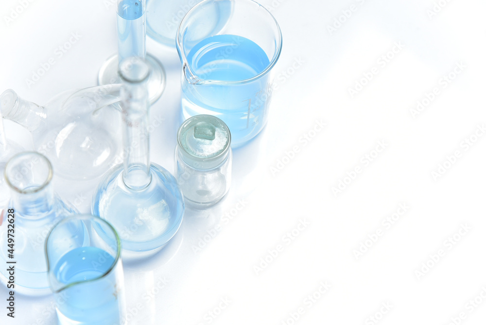 Glass laboratory glassware flask top view, laboratory research and tests with copy space Glass laboratory glassware flask top view, laboratory research and tests with copy space