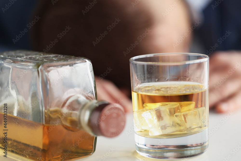 Young man drinks too much alcohol closeup Young man drinks too much alcohol closeup