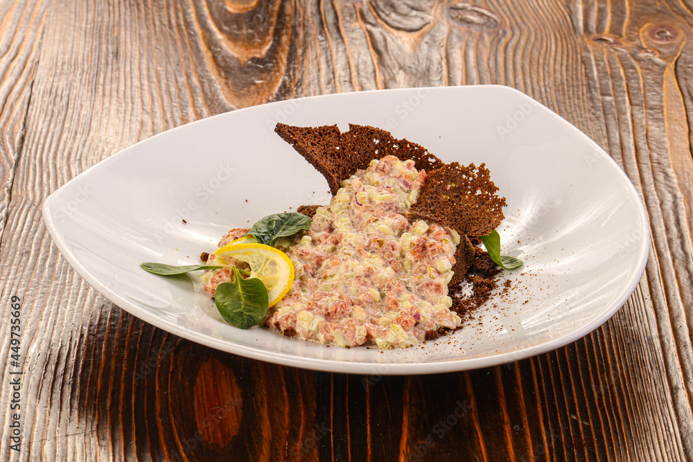 Tartar with beef meat served lemon Tartar with beef meat served lemon