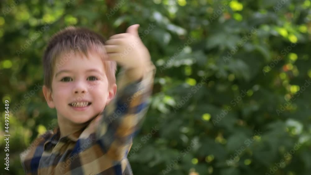 little boy showing thumbs up to the camera little boy showing thumbs up to the camera