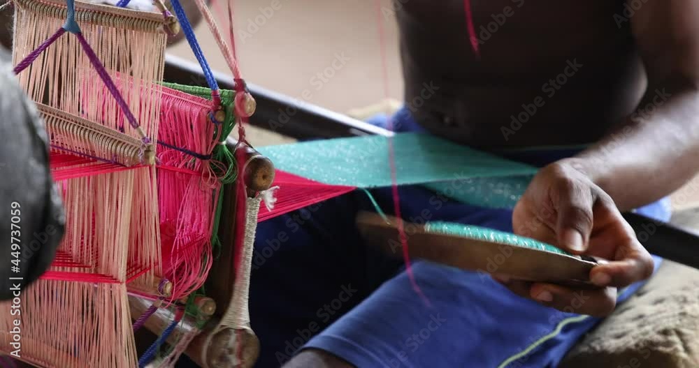 Handmade Kente cloth master weaver traditional Ghana. Town in Ghana