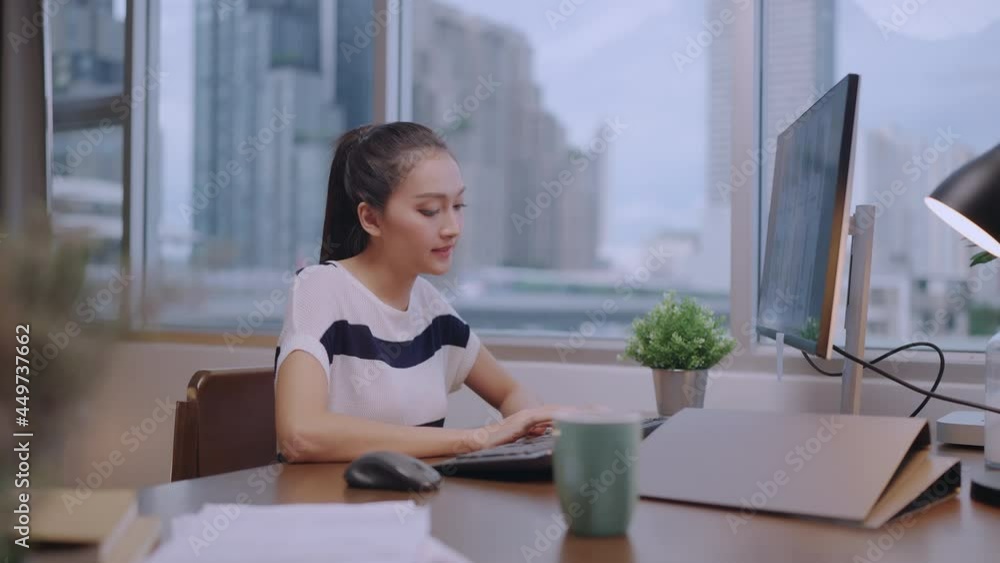 active asian female casual cloth working at home quarantine remote work online sit relax on working desk with cheerful and clam home interior background active asian female casual cloth working at home quarantine remote work online sit relax on working desk with cheerful and clam home interior background