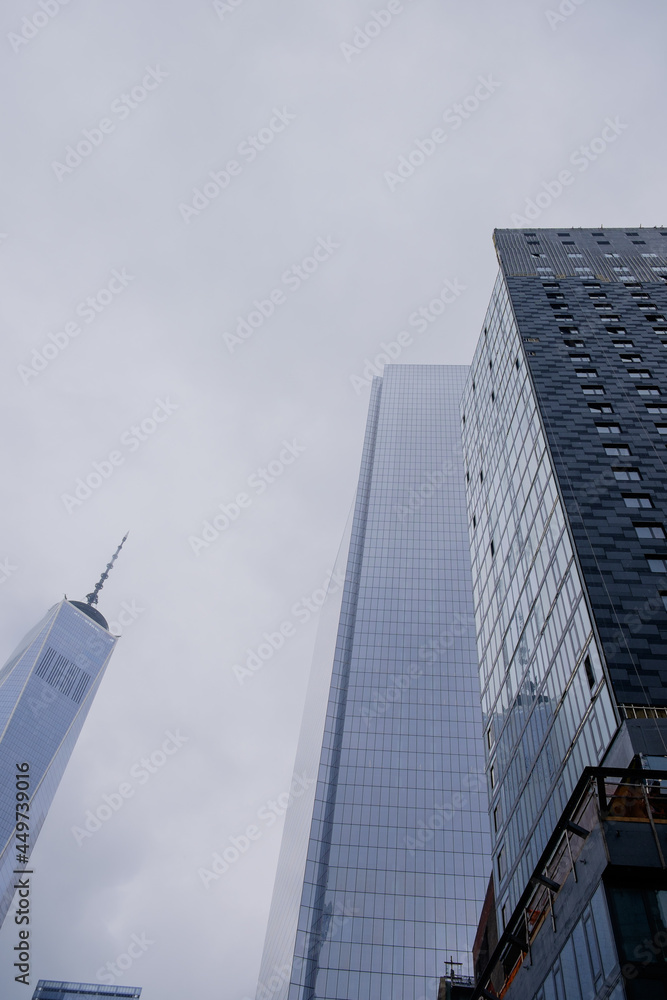 Lower Manhattan skyscrapers and the new freedom tower in early morning rain fog and mist Lower Manhattan skyscrapers and the new freedom tower in early morning rain fog and mist