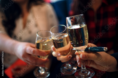 business people celebrate with glasses of champagne in hands after toast
