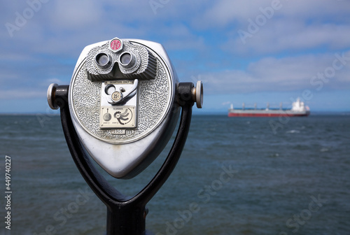 Retro coin-operated binoculars - also known as tourist binoculars - point to a large ship off the coast of Westport, WA
 photo
