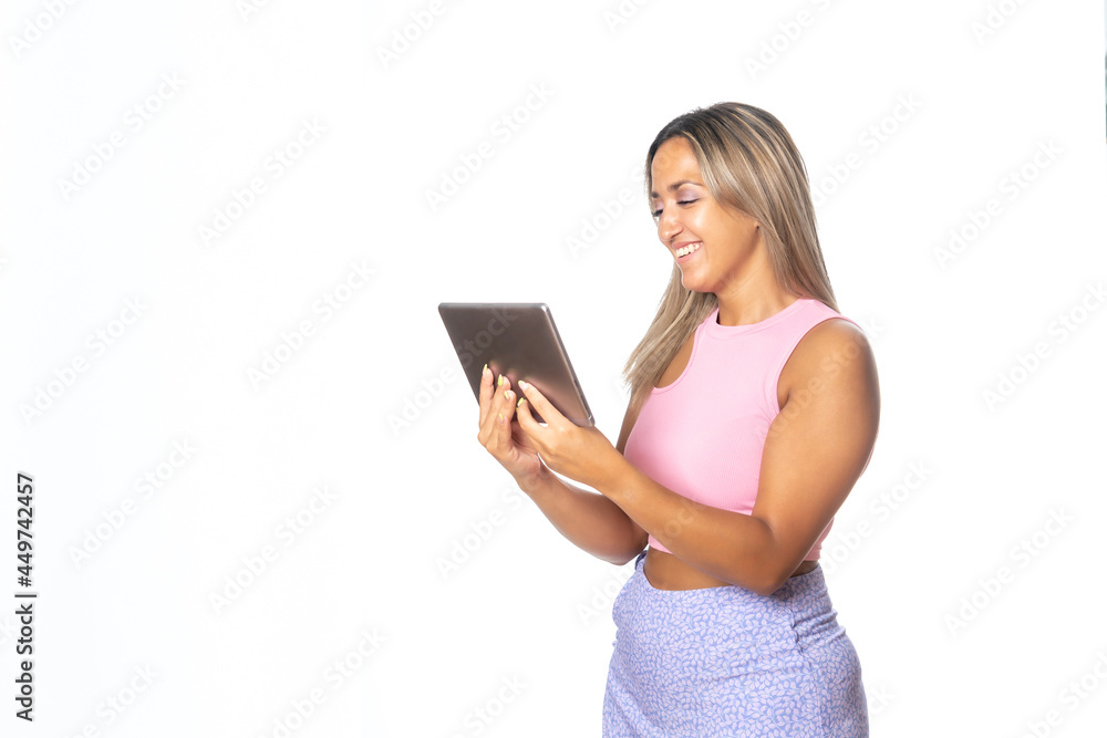 Super happy girl holding a tablet isolated on white background Super happy girl holding a tablet isolated on white background