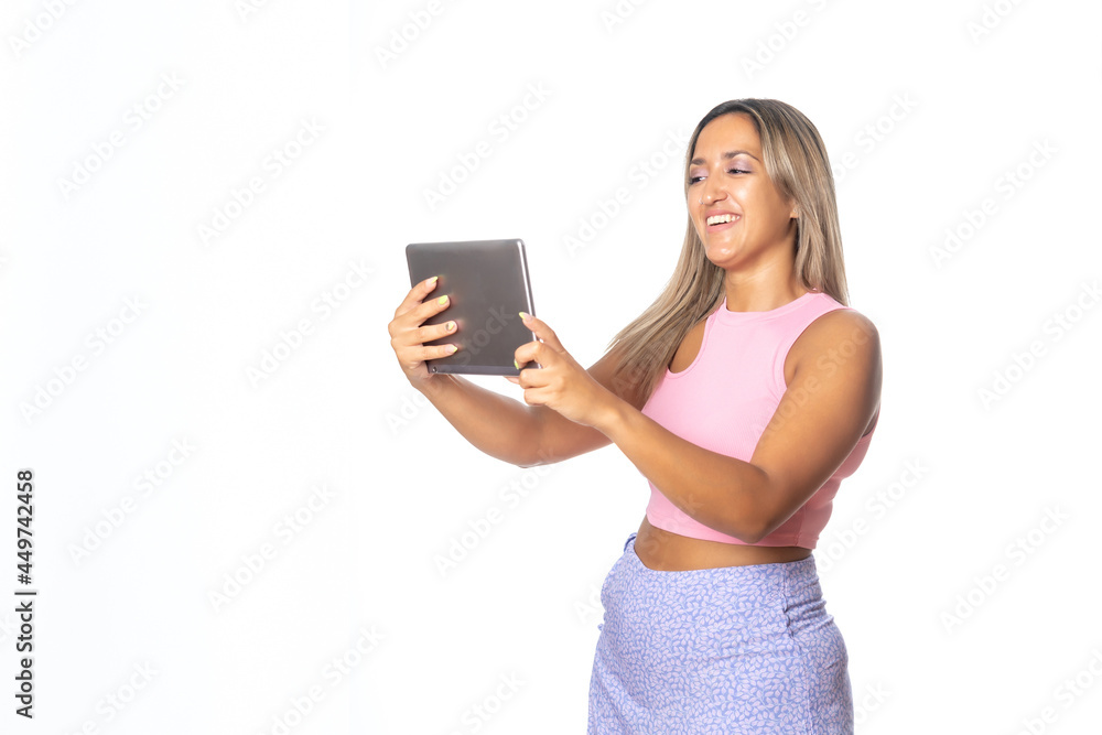 Super happy girl holding a tablet isolated on white background Super happy girl holding a tablet isolated on white background