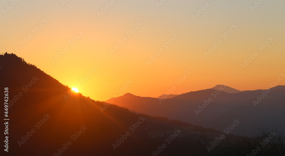 Magnificent bright sunset in the mountains in summer