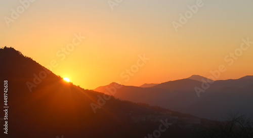 Magnificent bright sunset in the mountains in summer