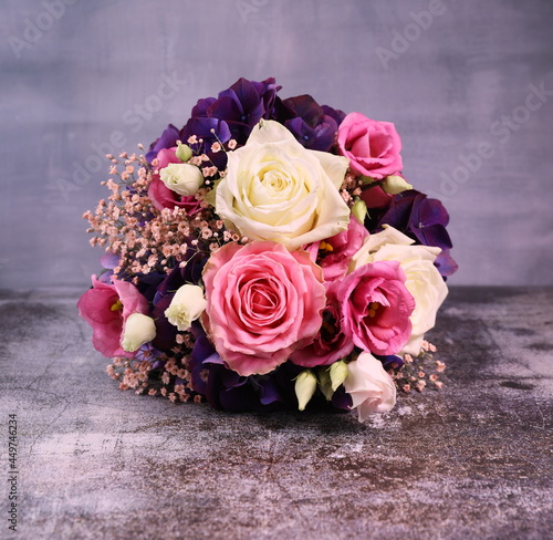 bouquet of pink  and white roses on the grey background