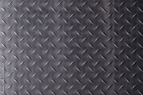 metal texture with diamond print. steel plate, dark gray background. © dmitr1ch
