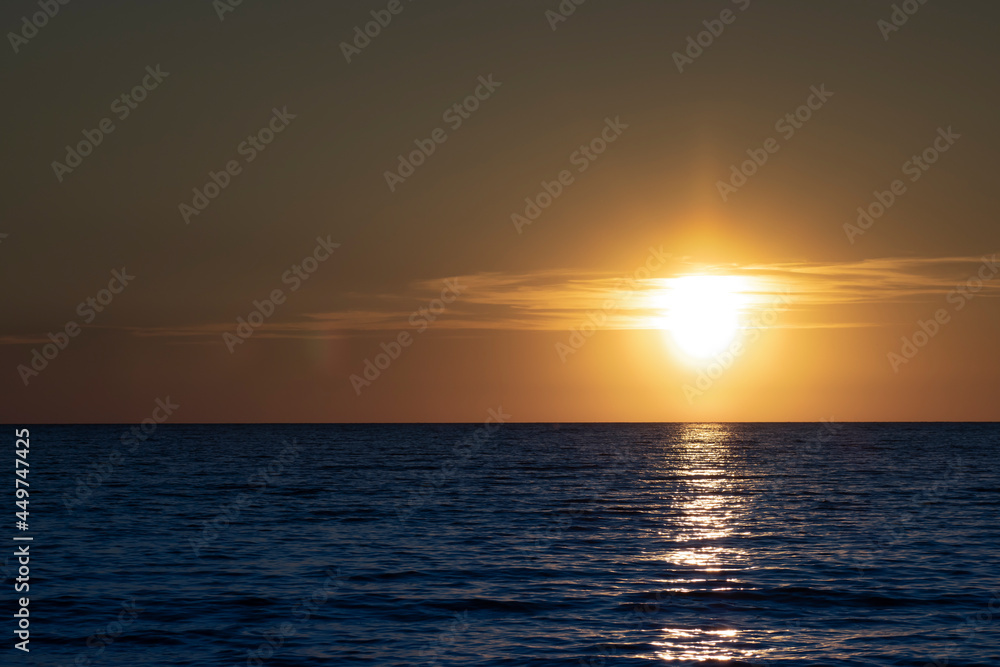 Sunset in the ocean. Beautiful seascape. Relaxation and summer beach vacation concept Sunset in the ocean. Beautiful seascape. Relaxation and summer beach vacation concept