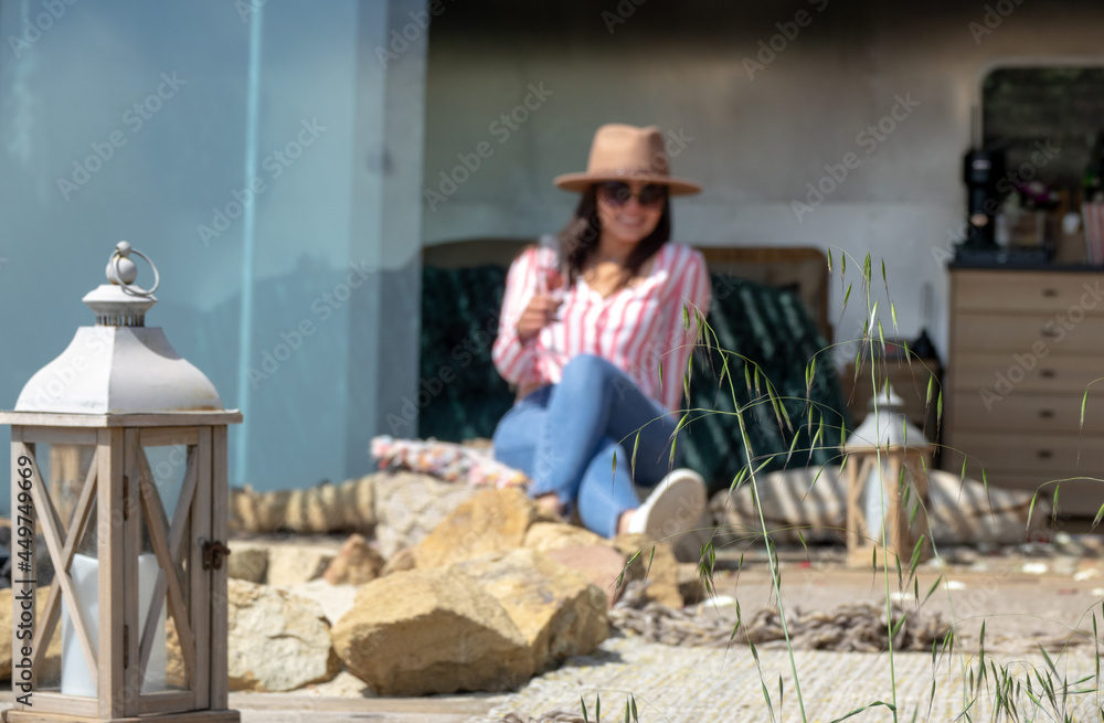 Beautiful woman relaxing in a luxury camping place in Malibu, California