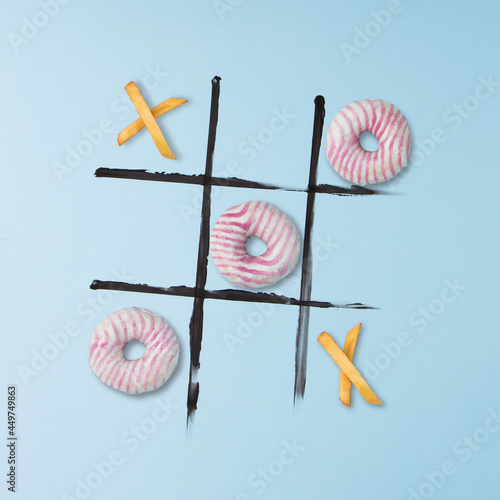 Donuts and french fries to play tic tac toe. photo