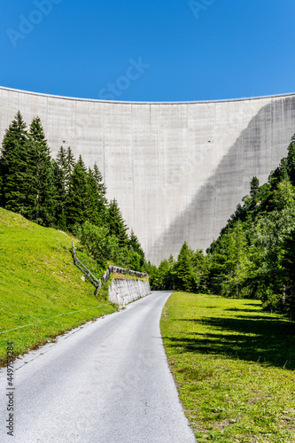 Huge concrete apline dam on sunny summer day. Zillergrundl Speicher, Zillertal Alps, Austria photo