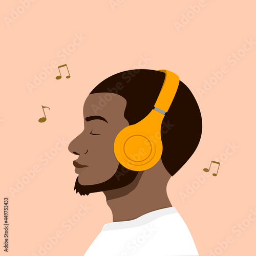 Black man listen music with yellow headphone