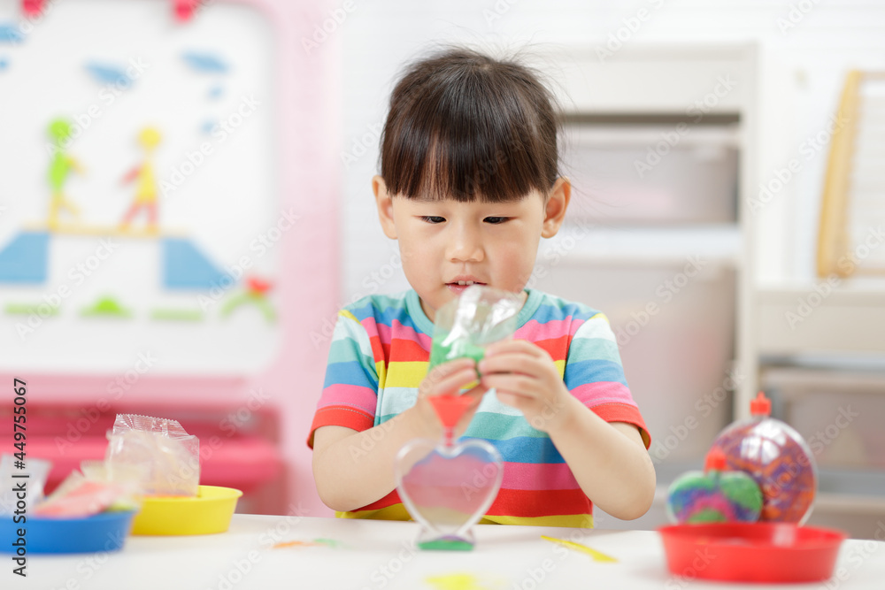 young girl making sand crafts for homeschooling young girl making sand crafts for homeschooling