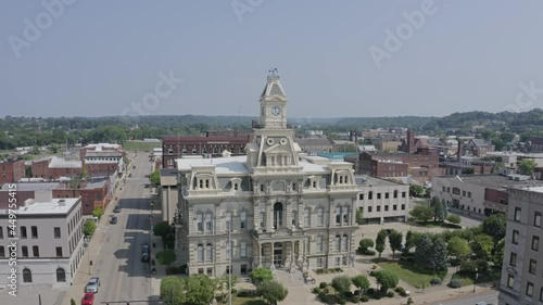 A rising aerial establishing shot of the Muskingum County Courthouse in downtown Zanesville, Ohio.  	 photo